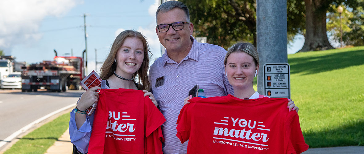 You Matter Shirts given out to students on sidewalk