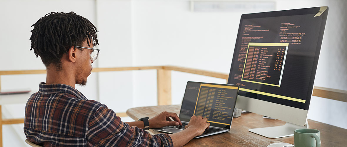 Student working at a computer on software development