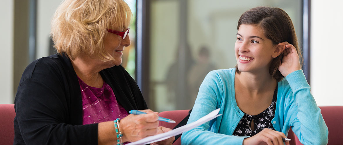 School Counselor talks with young student