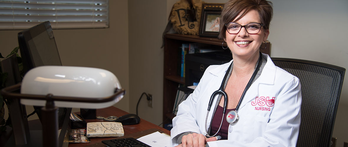 Post Master's DNP student sitting at desk