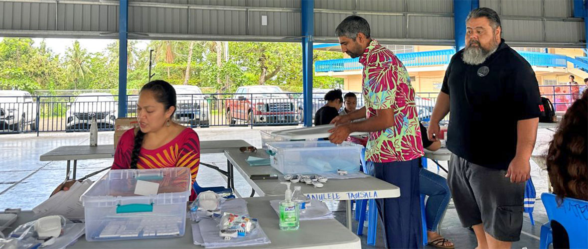 Public Health workers process water samples in a remote village