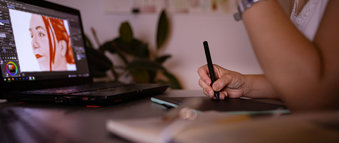 Female illustrator working at desk