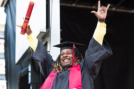 Student accepting diploma at graduation