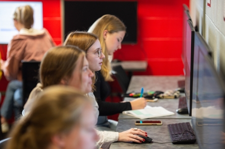Four students working on their computers