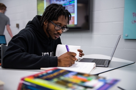 A student taking notes.