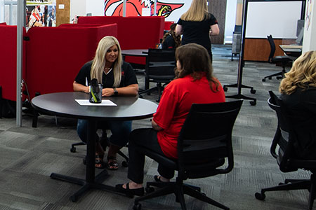 Coach working with student