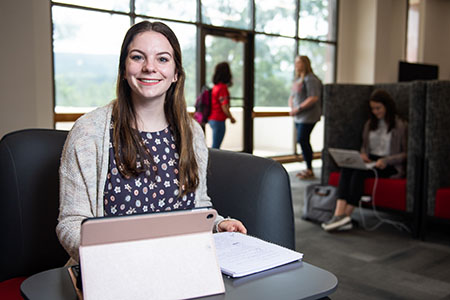 Student sitting in LIbrary